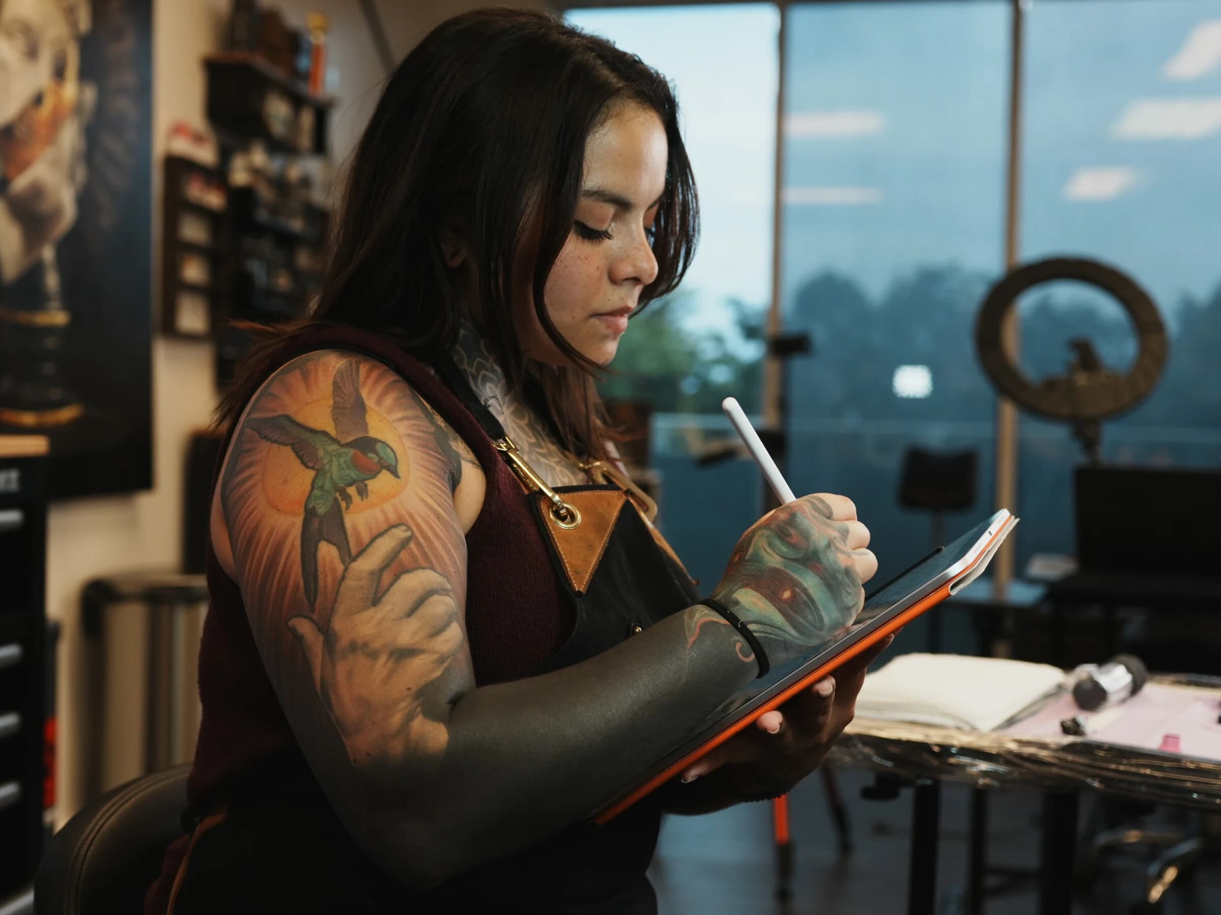 Eunny sketching a custom design at her station in the studio