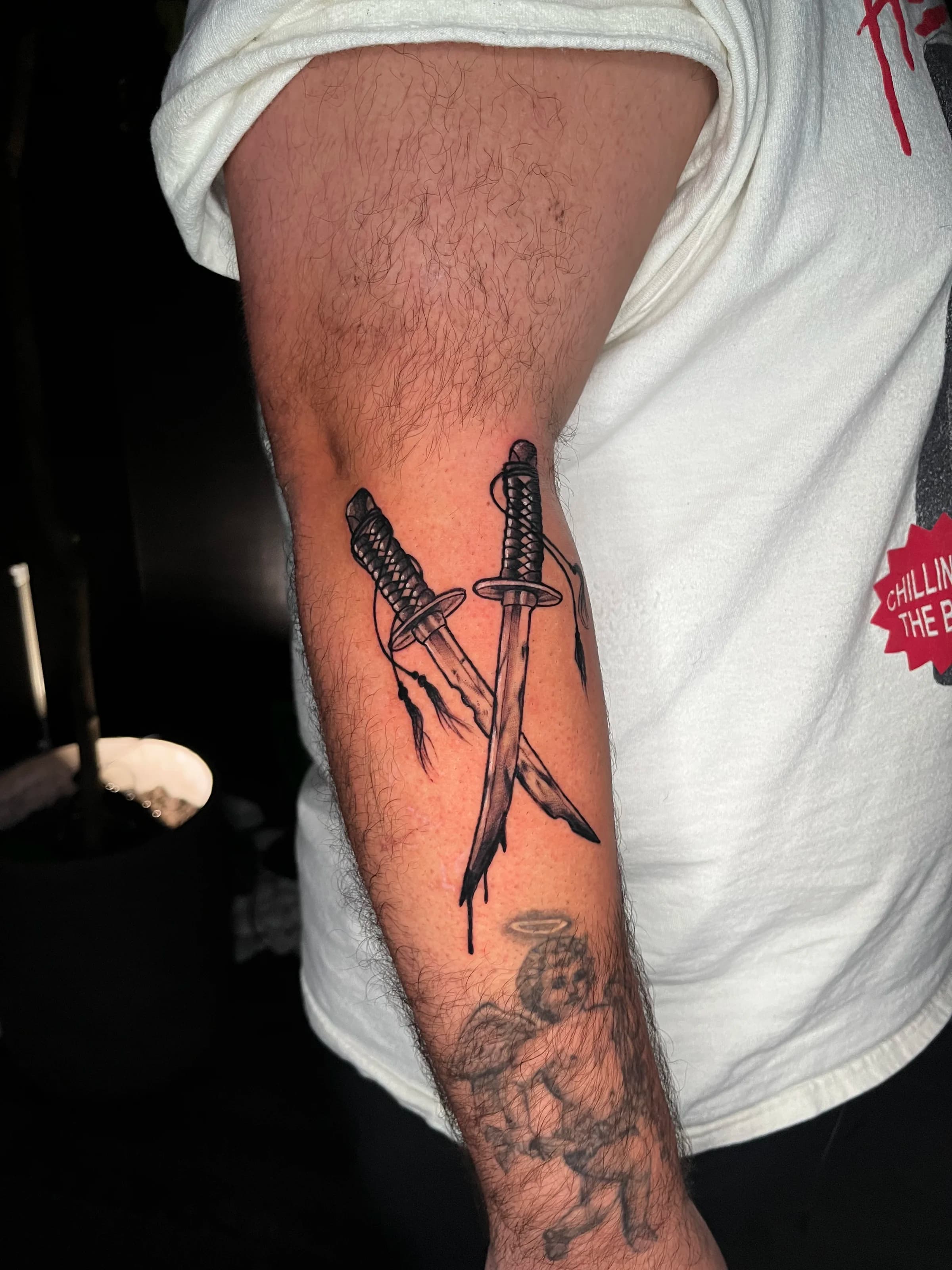 Crossed daggers in blackwork style